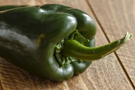 Close up of pasilla pepper sitting on wooden tableの写真素材