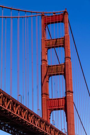 Close up of single tower of Golden Gate Bridge in San Francisco California from Fort Point National Historic Site on sunny morningのeditorial素材