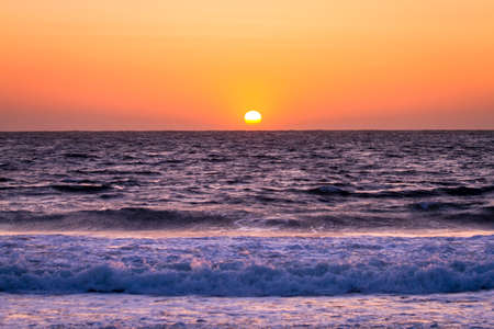 Sunset from Baker Beach in San Francisco California near Golden Gate Bridgeの写真素材