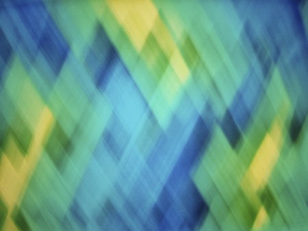 Bright blue, turquoise, green and yellow blurred diamond pattern abstract background artwork for creative graphic design or wall artの写真素材