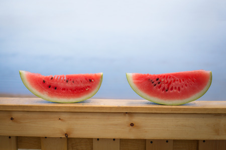 red watermelon is against the blue skyの写真素材