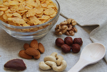 Natural corn flakes with nuts on natural fabric