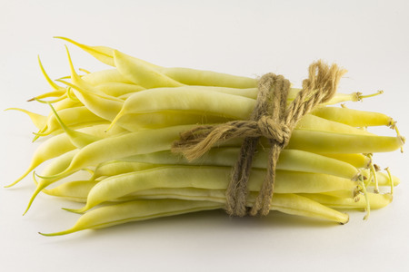Green beans on a white background linked natural ropeの写真素材