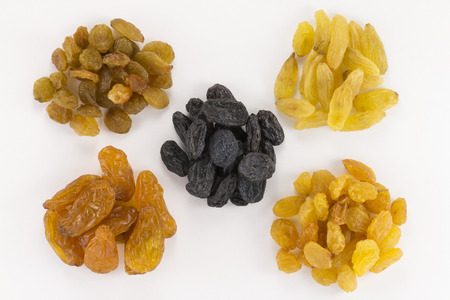 Colorful raisins on  white background five kinds of raisinsの写真素材