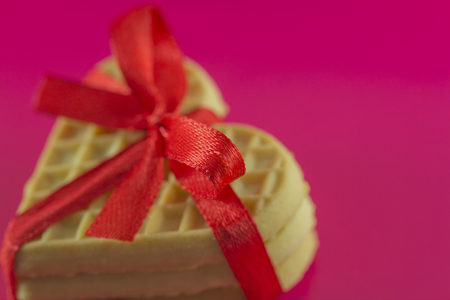 Valentine's Day - cookies in the form of hearts on a pink backgroundの写真素材