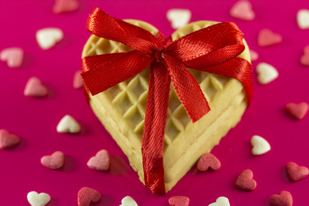 Valentine's Day - cookies in the form of hearts on a pink backgroundの写真素材