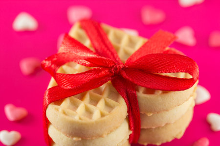 Valentine's Day - cookies in the form of hearts on a pink backgroundの写真素材