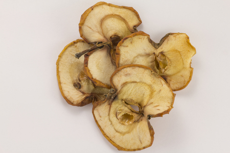 Dried slice of apple on a white backgroundの写真素材