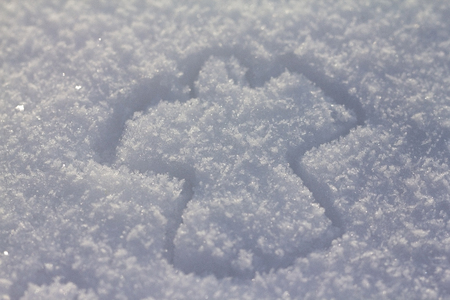 Snow Angel on a background of white snowの写真素材