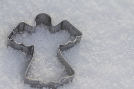 Snow Angel on a background of white snowの写真素材