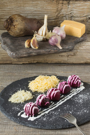 Beet ball with grated cheese and garlicの写真素材