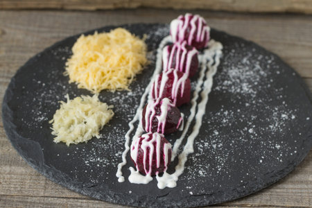 Beet ball with grated cheese and garlicの写真素材