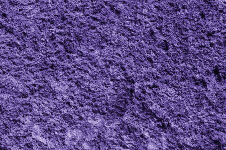 The texture of the stone wall of the porous surface, horizontal shot (photo is toned in ultra violet)の写真素材