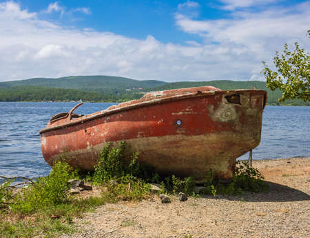 Old boat on the shores of Novik Bay. Russky island. Vladivostok.の写真素材