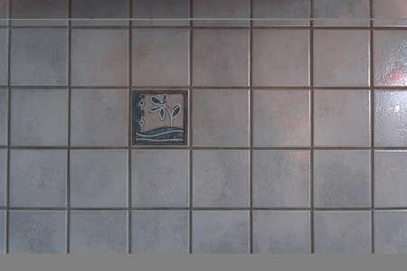Old tiles with decor on the background. Light tiled wall. High quality photoの写真素材