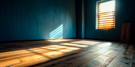 Empty room with wooden floor and sunlight through the window at night.の素材