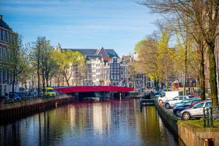 Canals and typical houses in Amsterdam. Amsterdam is the capital and most populous city of the...