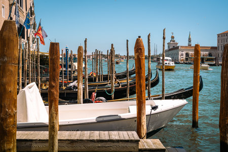 Gondolas moored at the Grand Canal in Venice, Italyの写真素材