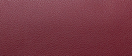 Red leather texture background. Close up of textured leather background.の素材