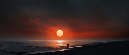 Sunset over the sea with a silhouette of a man on the beachの素材