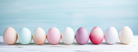 Colorful easter eggs on pastel background with copy space.の素材