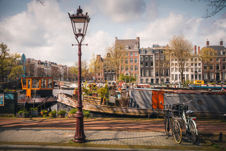 Canals and typical houses in Amsterdam. Amsterdam is the capital and most populous city of the Netherlands.の写真素材