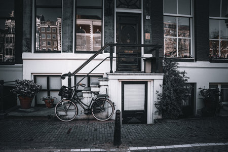Bicycle parked in front of a restaurant in Amsterdam, Netherlands.の写真素材