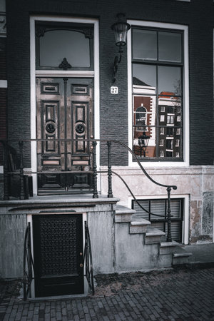 Street view of old buildings in Amsterdam, Netherlands. Toned.の写真素材