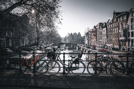 Amsterdam canals with bicycles and bridge in Amsterdam, Netherlands.の写真素材
