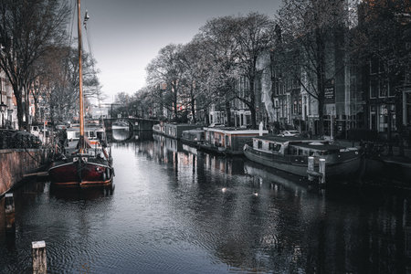 Amsterdam canals and bridges with boats. Holland, Netherlands.の写真素材
