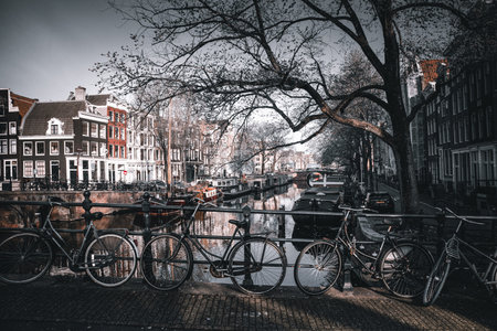 Amsterdam canals with bicycles and old houses. Netherlands. Toned.