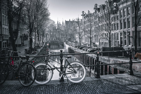 Amsterdam canals with bicycles and bridges.の写真素材