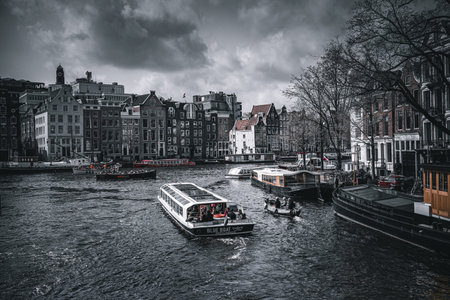 Amsterdam canals with boats and typical houses, Holland.の写真素材