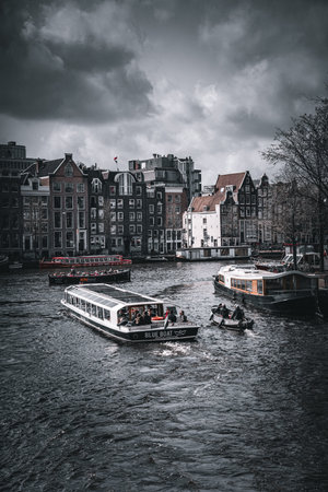 Tourist boats on the canals of Amsterdam.の写真素材
