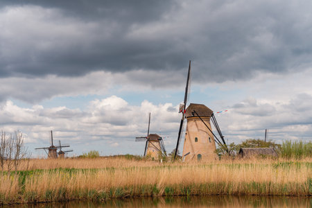 Windmills in Kinderdijk, Netherlands with stormy cloudsの写真素材
