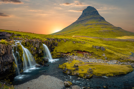 Famous Kirkjufellsfoss waterfall and Kirkjufell mountain in Icelandの写真素材