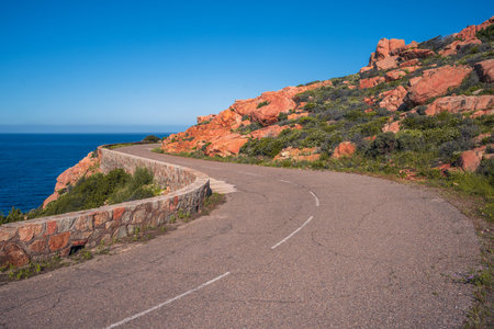 Spectacular red cliffs along the west coast of Corsica between Calvi and GalÃ©ria, Franceの写真素材