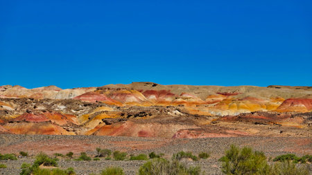 Wind eroded square hills, minarets, peaks, Efege mounds. Clean blue sky. Stunning wind-eroded yellow landform landscape. Devil(Ghost) City, Xinjiang China. Sep. 2018の写真素材