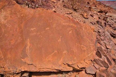 Site of ancient petroglyphs. Carved with giraffes, horses and other animals.の写真素材