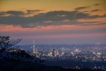 Dynamic Clouds and Urban Scenery: A image of Taipei's Evening Sky Mesmerizing Taipei Twilight: Orange Skies and Illuminated Cityscapeの写真素材