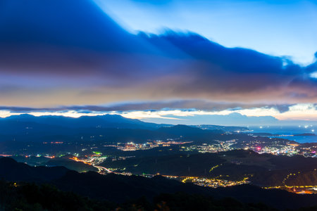 Sea fishing boat lights, village street lights. Lively and colorful night view. At night, enjoy the view of the sky from the top of the mountain.の写真素材