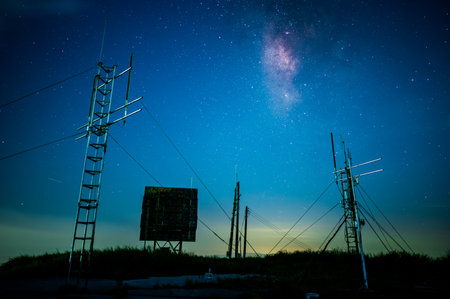 Mysterious galaxy and starry sky. Abandoned antenna equipment at the station. Viewing platform of Caoshan Radar Station in Ruifang, Taiwanの写真素材