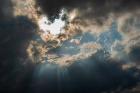 Catching the Light: Crepuscular Rays Amidst Mountain's Ever-Changing Clouds. The Wufenshan Weather Radar Station stands on the top of the mountain. Taiwanの写真素材
