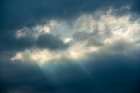 Mountain Summit Magic: Capturing the Dance of Crepuscular Rays in the Clouds. The Wufenshan Weather Radar Station stands on the top of the mountain. Taiwanの写真素材
