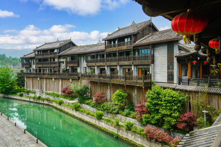 Wooden houses, green rivers, lush vegetation. Beautiful scenery. Zhoushui Ancient Town is a historical and cultural attraction. Chongqing, China.の写真素材