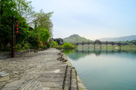 Rivers, towns, mountains and the Fengyu Bridge, enjoy the beautiful scenery. The Puhua Dark River is a masterpiece of nature and the root of Tujia culture.の写真素材