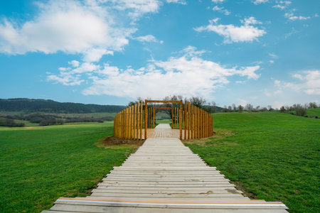 Green meadow with wooden walkway and wooden circular landscape. Fairy Mountain National Forest Park, Wulong County, Chongqing, China.の写真素材
