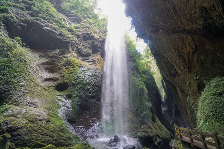 Waterfalls in the canyon fall from the sky. Like a silver-white chain. The Three Natural Bridges are...