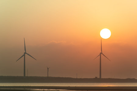 Offshore wind farms are great for enjoying the scenery and watching the sunset. Gaomei Windmill...