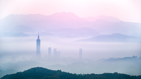 Witness the serene moment of early morning sunrise, dynamic cloud formations, and cascading mountains accentuating the backdrop. New store in Taiwan.の写真素材